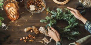 beautiful-woman-making-christmas-wreath-using-fresh-royalty-free-image-1700584703